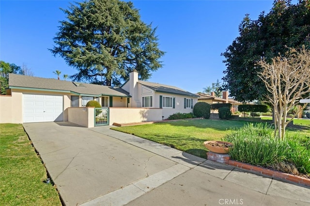 ranch-style house featuring a garage and a front lawn