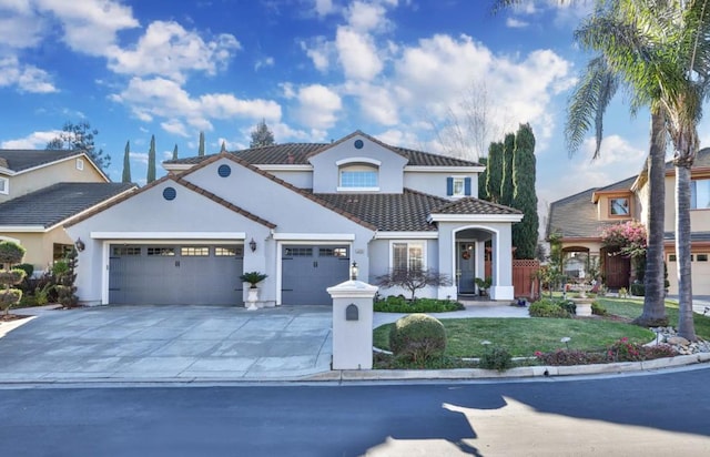 mediterranean / spanish house featuring a garage