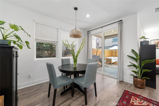 dining room with hardwood / wood-style floors