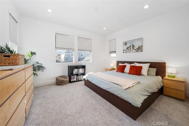 bedroom with light colored carpet