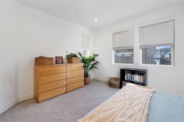 bedroom featuring light carpet