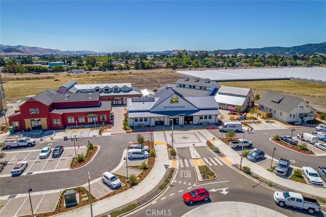 birds eye view of property with a mountain view