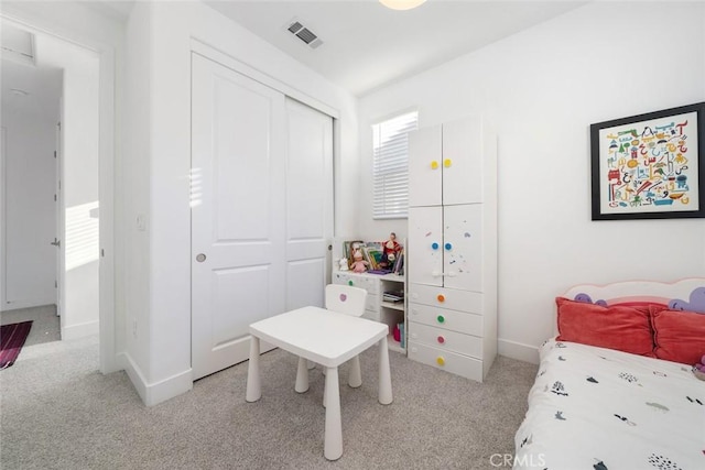 carpeted bedroom featuring a closet