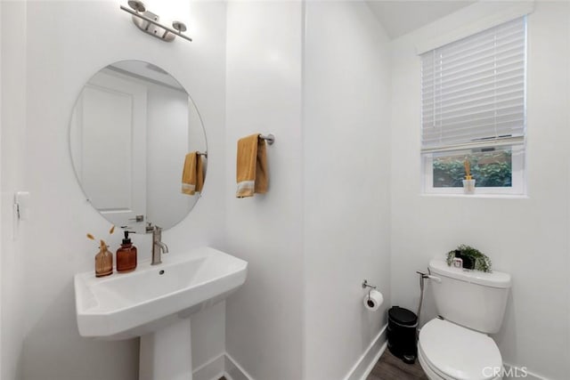 bathroom with sink and toilet