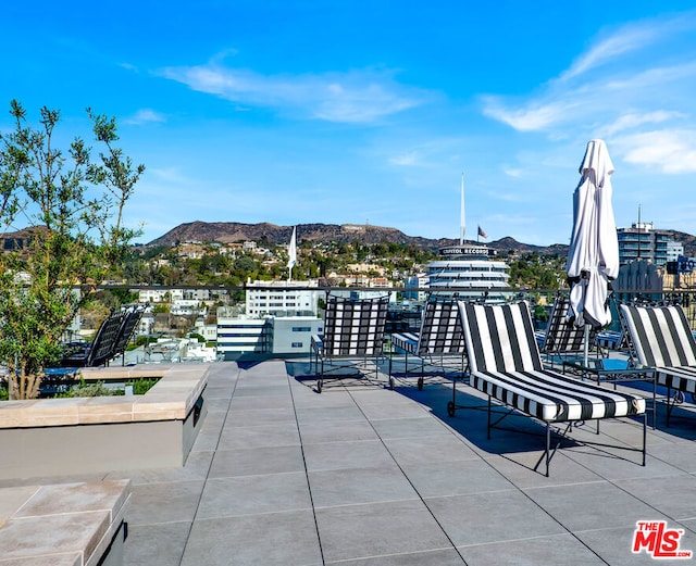 view of patio / terrace with a mountain view