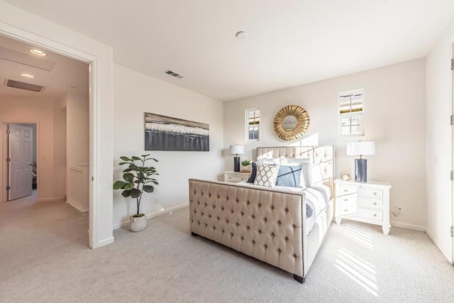 bedroom featuring light carpet