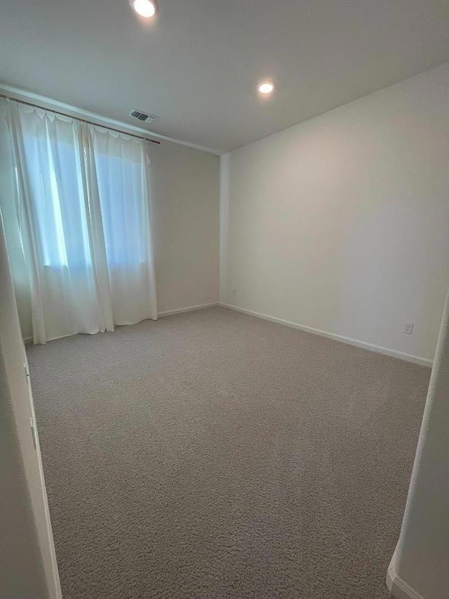 spare room featuring carpet flooring