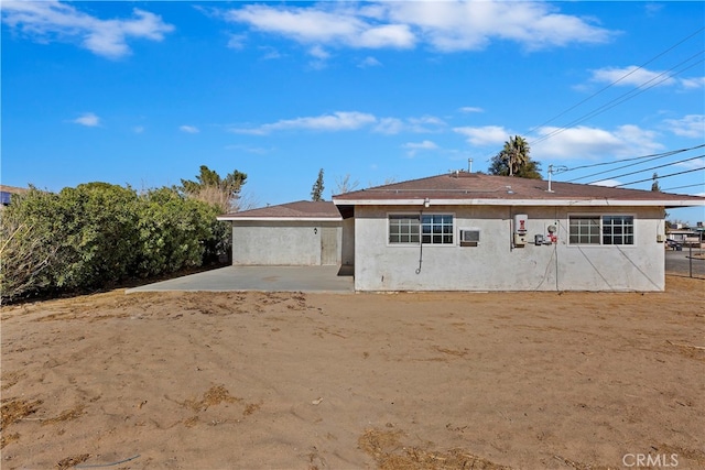 rear view of property featuring a patio