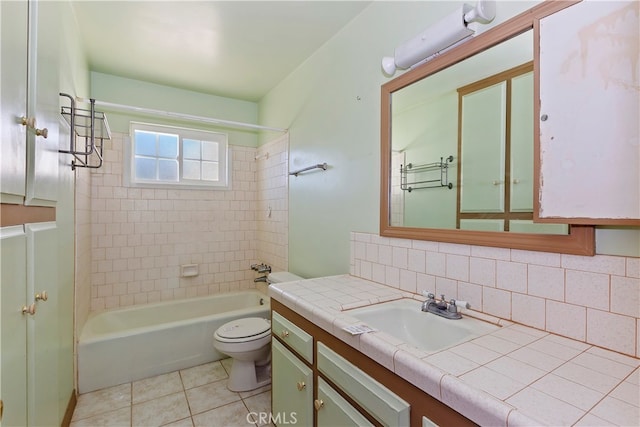 full bathroom with toilet, decorative backsplash, tiled shower / bath, tile patterned flooring, and vanity