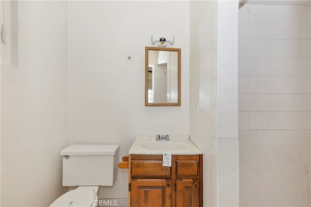 bathroom with toilet and vanity