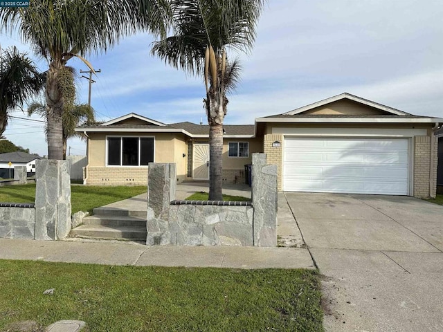 single story home with a garage and a front yard