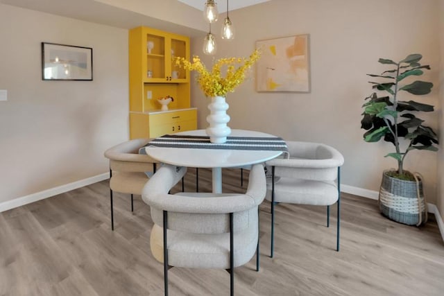 dining area with light hardwood / wood-style flooring