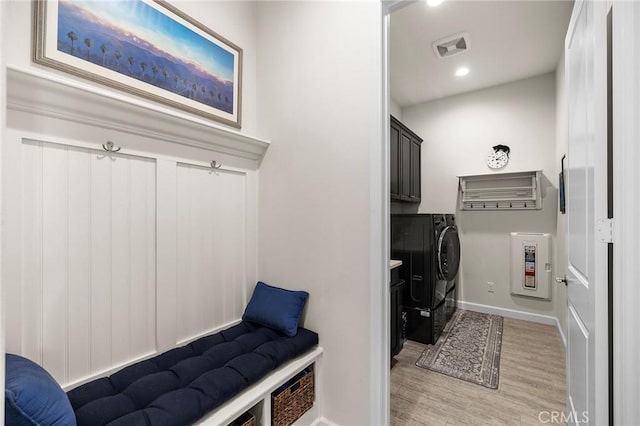 mudroom featuring light hardwood / wood-style floors and separate washer and dryer