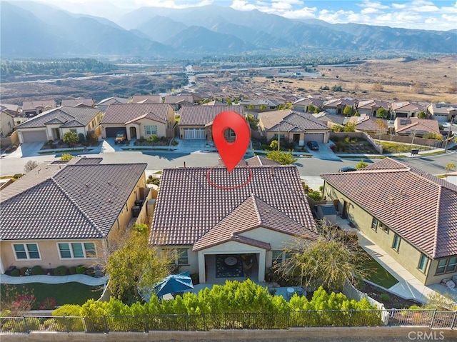 drone / aerial view featuring a mountain view