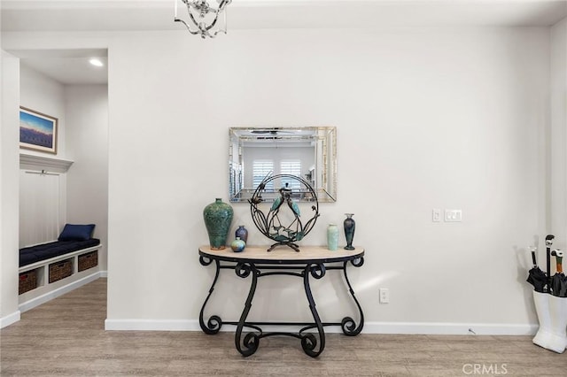 room details featuring hardwood / wood-style floors and a notable chandelier