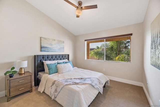 bedroom featuring ceiling fan, light colored carpet, and lofted ceiling