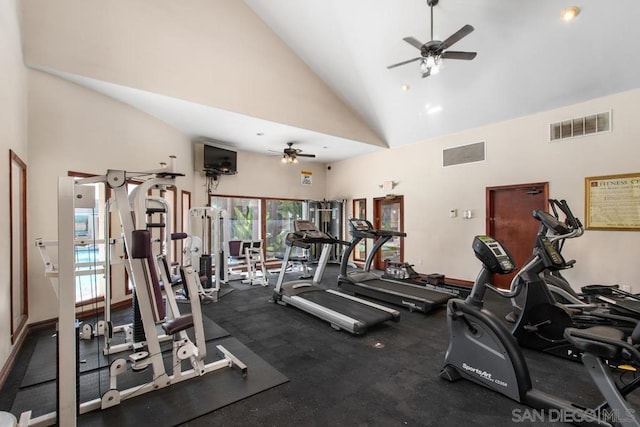 exercise room featuring high vaulted ceiling and ceiling fan