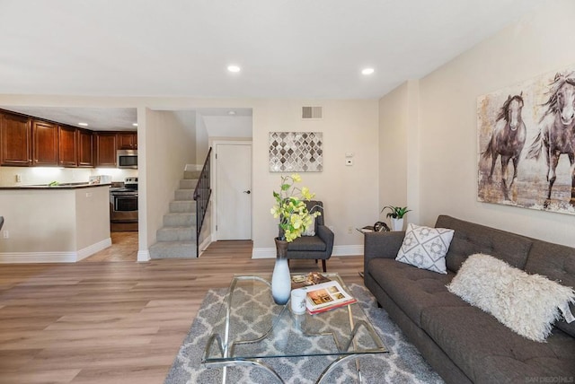 living room with light hardwood / wood-style floors