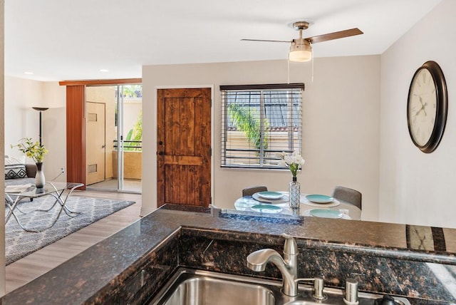 dining area featuring ceiling fan and sink