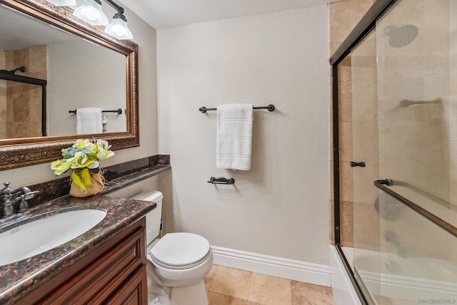 full bathroom with toilet, tile patterned floors, vanity, and shower / bath combination with glass door