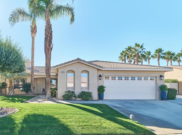 view of front facade with a garage and a front yard