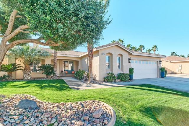 view of front of home with a front lawn and a garage