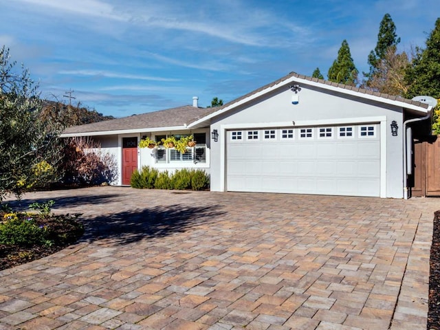 ranch-style home featuring a garage