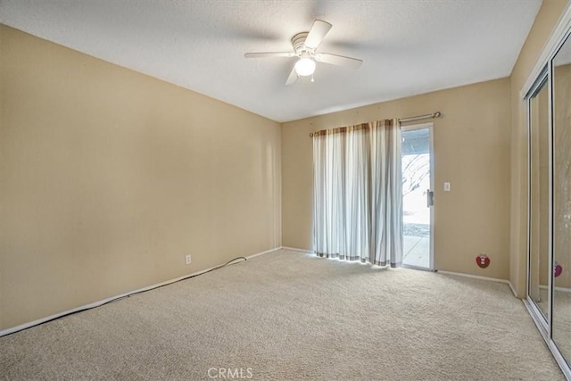 unfurnished room with light carpet and ceiling fan