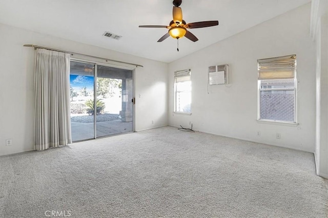 carpeted empty room with ceiling fan, lofted ceiling, and a wall mounted air conditioner