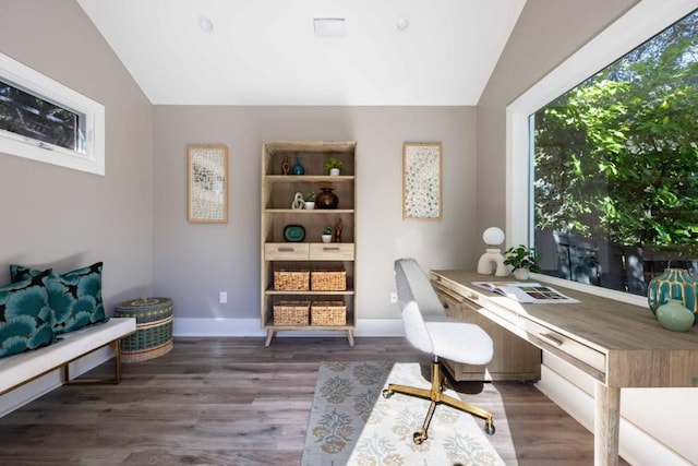 home office featuring dark hardwood / wood-style flooring and vaulted ceiling