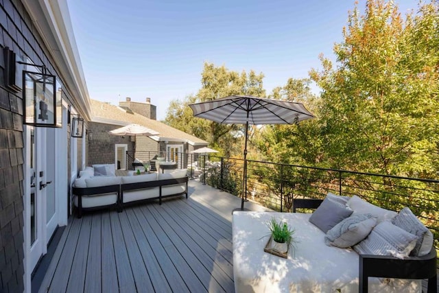 wooden deck featuring outdoor lounge area