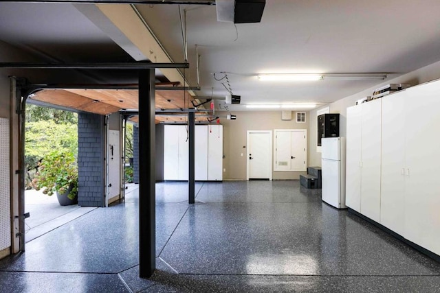 garage with white fridge