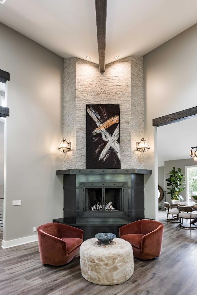 sitting room with wood-type flooring and a fireplace