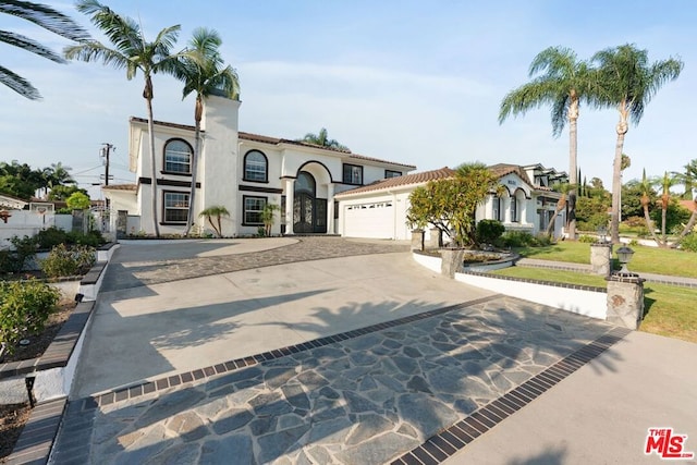 mediterranean / spanish-style house featuring a garage