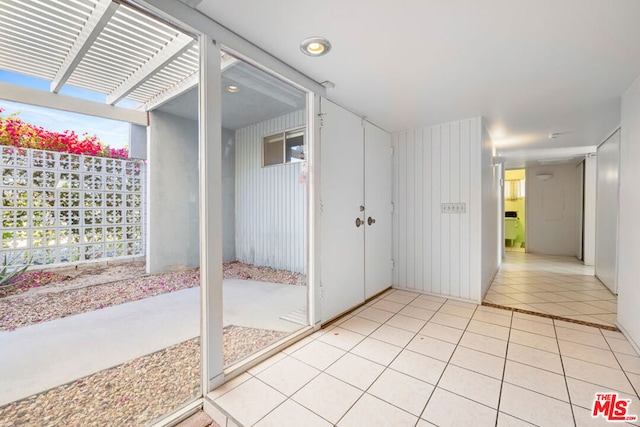 interior space featuring a wealth of natural light and light tile patterned floors