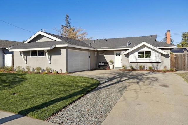 ranch-style house featuring a garage and a front lawn