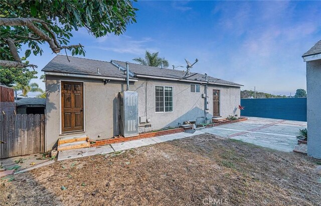 rear view of property with a patio area