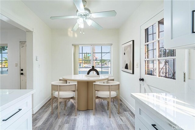 dining room featuring light wood-type flooring and ceiling fan