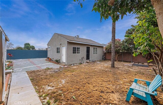 rear view of property with a patio