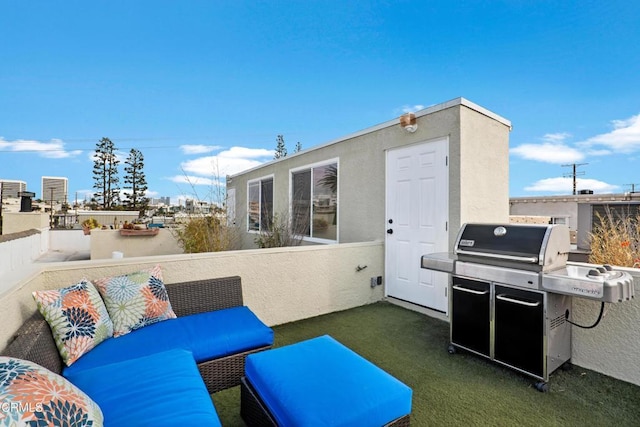 view of patio featuring fence and area for grilling