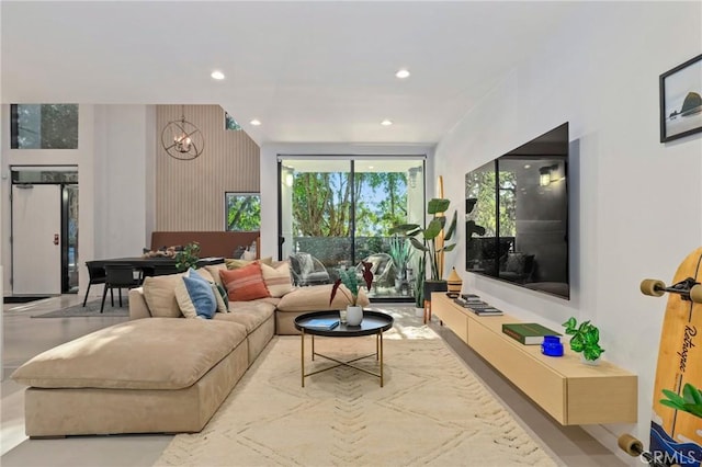 living room featuring a notable chandelier