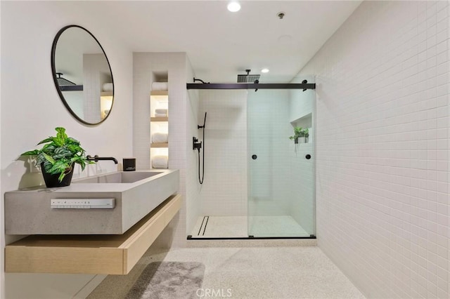 bathroom with vanity and an enclosed shower