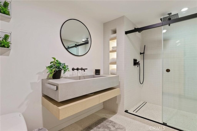 bathroom featuring vanity and walk in shower