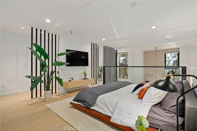 bedroom with light hardwood / wood-style floors