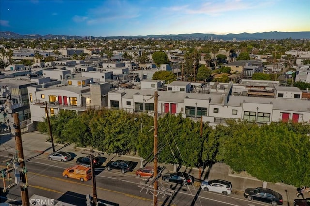 birds eye view of property featuring a mountain view