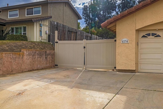 view of side of property with a garage