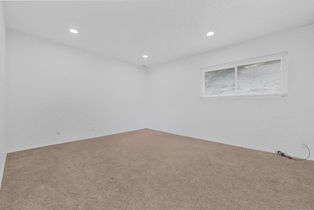 unfurnished room featuring carpet floors