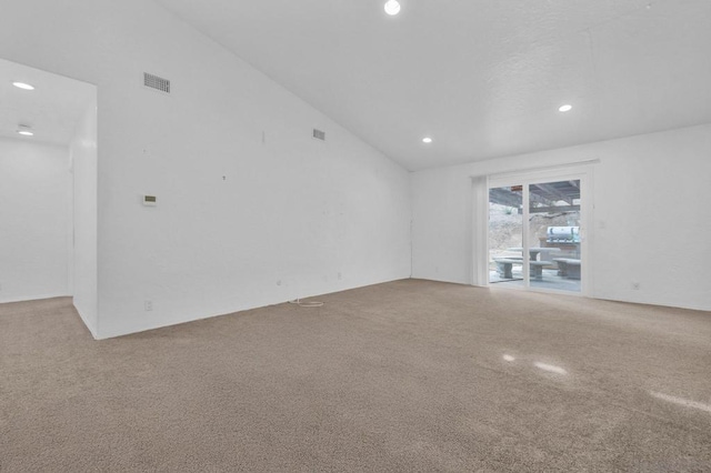 empty room featuring high vaulted ceiling