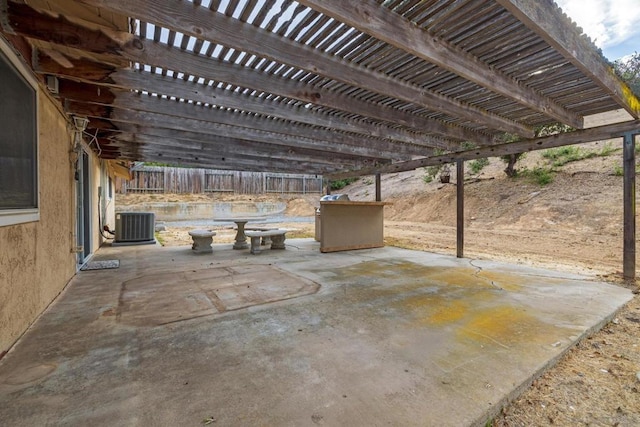 view of patio / terrace featuring central AC and a pergola