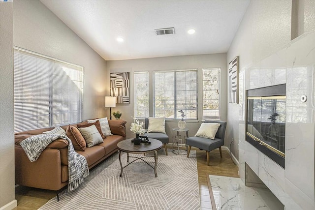 living room featuring vaulted ceiling